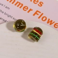 Detailed macro view of 3D resin miniature burgers for DIY crafts and earring making - Green