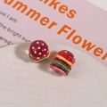 Macro detail of two miniature resin hamburger charms for DIY earring and jewelry making - Deep Pink