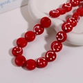 Macro shot of 14mm red glass beads with white smiley face patterns for DIY jewelry - Smile Face Style / 1 Piece / Dark Red