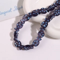 Macro view of purple fish-shaped ceramic beads with blue dots for DIY jewelry making - Purple Fish With Blue Dots (No. 10)
