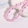 Macro shot of pink ceramic fish beads with white polka dots for DIY jewelry making - Pink Fish With White Dots (No. 13)