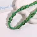Macro view of handmade green ceramic fish beads with red polka dots for DIY jewelry - Green Fish With Red Dots (No. 15)