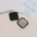Detail of square dark green satin fabric buttons with smooth silver metal backing - Green