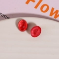 Macro shot of oval red resin glitter cabochons for DIY jewelry and phone case making - 1 Piece / Red