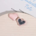 Detail view of pink satin heart buttons for DIY jewelry with magnetic metal backing - Pink
