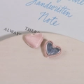 Detail showing pink satin fabric heart buttons with metal base for DIY jewelry crafts - Pink