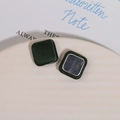 Detail of square dark green fabric covered buttons with smooth metal backing for DIY crafts - Green
