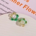 Detail of DIY resin flower charms with green dried flowers, gold foil and pearl center - Green