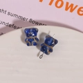 Macro shot of blue bear-shaped glass beads with gold edges for DIY jewelry making - 1 Piece / Blue