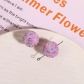 Macro detail of pink glitter sugar ball resin beads for DIY jewelry making - Purple