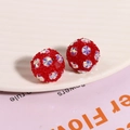 Macro shot of red Shamballa earrings featuring sparkling star-shaped crystal embellishments - Red (1 Piece)