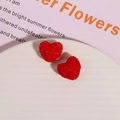 Macro shot of 3D red heart resin beads with sugar-like texture for DIY jewelry making - Red
