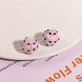 Macro shot of pink sugar ball beads with 3D hearts for DIY earring jewelry making - 1 Piece / Pink