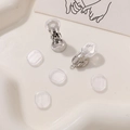 Detailed view of silver clip-on earring converters with clear silicone anti-slip pads - Silver (With Loop)