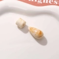 Close-up of marble-textured resin beads in beige and brown for DIY earring making - Creamy White Waterdrop And Cylinder Style