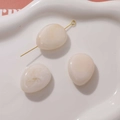 Close-up of teardrop resin beads with smoke effect for DIY jewelry accessories - 1 Piece / White