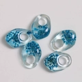 Macro shot of 5pcs transparent resin pendants with embedded blue dried flowers - Blue