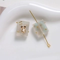 Close-up of matte gradient resin square beads with gold rabbit charms for DIY jewelry - 1 Piece / Gray