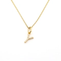 Detailed macro shot of a gold-toned letter Y pendant necklace with sparkling crystal inlay - Letter Y (DG-XL00159-Y)