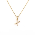 Detailed macro of golden letter X pendant necklace set with sparkling white crystals - Letter X (DG-XL00159-X)