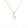 Detailed close-up of a sparkling micro-pave letter U pendant on a fine gold chain necklace - Letter U (DG-XL00159-U)