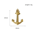 Detalle de colgante de ancla dorada con dimensiones 24mm altura y 18mm anchura - Ancla