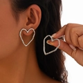 Detail shot of large silver liquid heart earrings with hammered metal texture on model - 01 Hammered Hollow Heart (Silver) (3327)