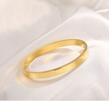 Elegant 18K gold-plated stainless steel geometric hinge bangle on white silk background - 18K Gold