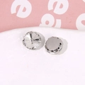 Close-up of faceted waterdrop rhinestones with silver metal claw bases for DIY crafts - Round