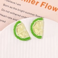 Detailed macro of vibrant resin lemon slice charms for DIY jewelry and crafts - Green