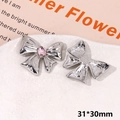 Macro shot of silver butterfly charms with pink rhinestone and size detail of 31x30mm - Pink Rhinestone Bowknot Type A