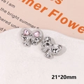 Detailed macro view of a silver bow shoe charm with pink heart crystals, size 21x20mm - Pink Rhinestone Bowknot Type B