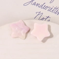 Macro view of gradient glitter star resin charms and solid pink star-shaped DIY accessories - Pink & White