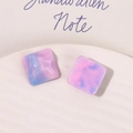Macro shot of square resin accessories with pink blue marble swirl and glitter - Deep Pink