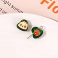 Detailed view of green enamel dragon boat festival earrings with Fu character and doll charm - Green