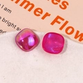 Macro detail of pearlescent rose pink resin squares with shimmering aurora finish - Iridescent Rose Red Square Style