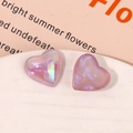 Macro detail of iridescent heart resin charms with glitter and pearlescent purple finish - Iridescent Purple Heart Style