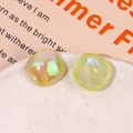 Close-up of shimmering iridescent resin square cabochons with glitter for DIY jewelry making - Iridescent Yellow Square Style