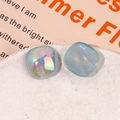 Close-up of square mermaid glitter resin patches in a white ceramic tray - Iridescent Blue Square Style