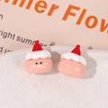 Dettaglio di piccoli elfi di Natale in resina rosa per gioielli fai-da-te e accessori - Rosa