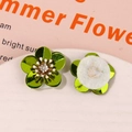 Macro shot of green sequin flower charms with rhinestone center for DIY apparel decor - Grass Green