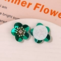 Detailed view of green petal flower accessories with rhinestones and white felt backing - Emerald Green