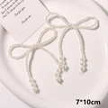 Detail view of a 7x10cm handmade pearl bow with tassels for DIY shoe decoration - Style 7 (7*10cm) / Pearl White Tassel Style