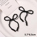 Detail view of handmade black pearl bow shoe charms for clogs, sized 5.7x6.5cm - Style 10 (5.7*6.5cm) / Black Woven Style