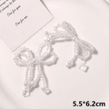 Detail of handmade pearl bow charms with hanging crystal pendants on a tray - Style 7 (5.5*6.2cm) / White Pearl Transparent Style