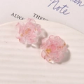 Detailed macro of pink resin flower earring charms with gold foil inside on ceramic tray - Pink Camellia (B41—3—1—5) / Pink
