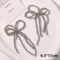 Detailed close-up of handmade pearl bow charms with long tassels for shoe accessories - Style 1 (6.5*11cm) / Silver Long Tassel Style