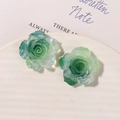 Close-up of green resin rose earrings with sparkling glitter and translucent petals - Grass Green