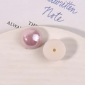 Close-up of pearlescent pink and creamy white acrylic half-round beads for DIY crafts - Light Purple