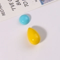 Detail of sky blue round and bright yellow teardrop resin beads for DIY jewelry making - Blue Half-Round and Yellow Waterdrop Set